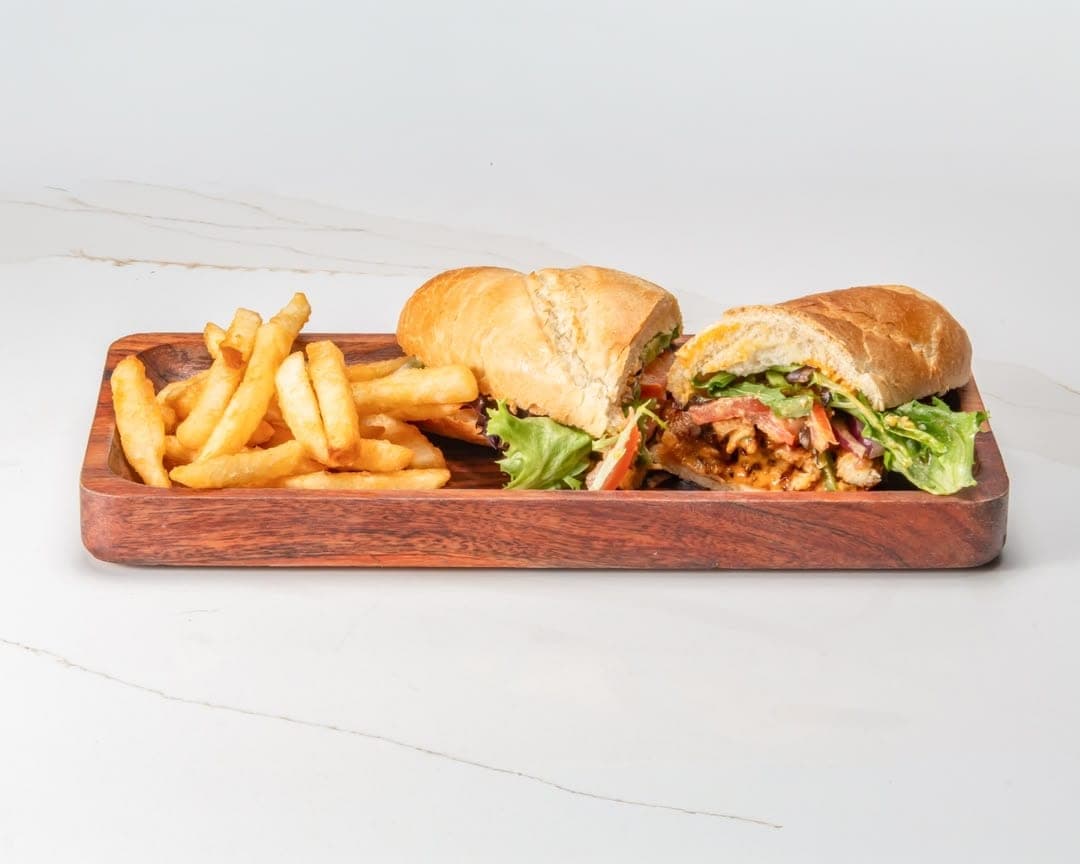 Ethiopian-style chicken sandwich with fries at Eri Star Cafe