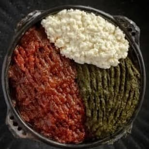 Special Kitfo — hand-minced raw beef with ayib and gomen, Ethiopian delicacy